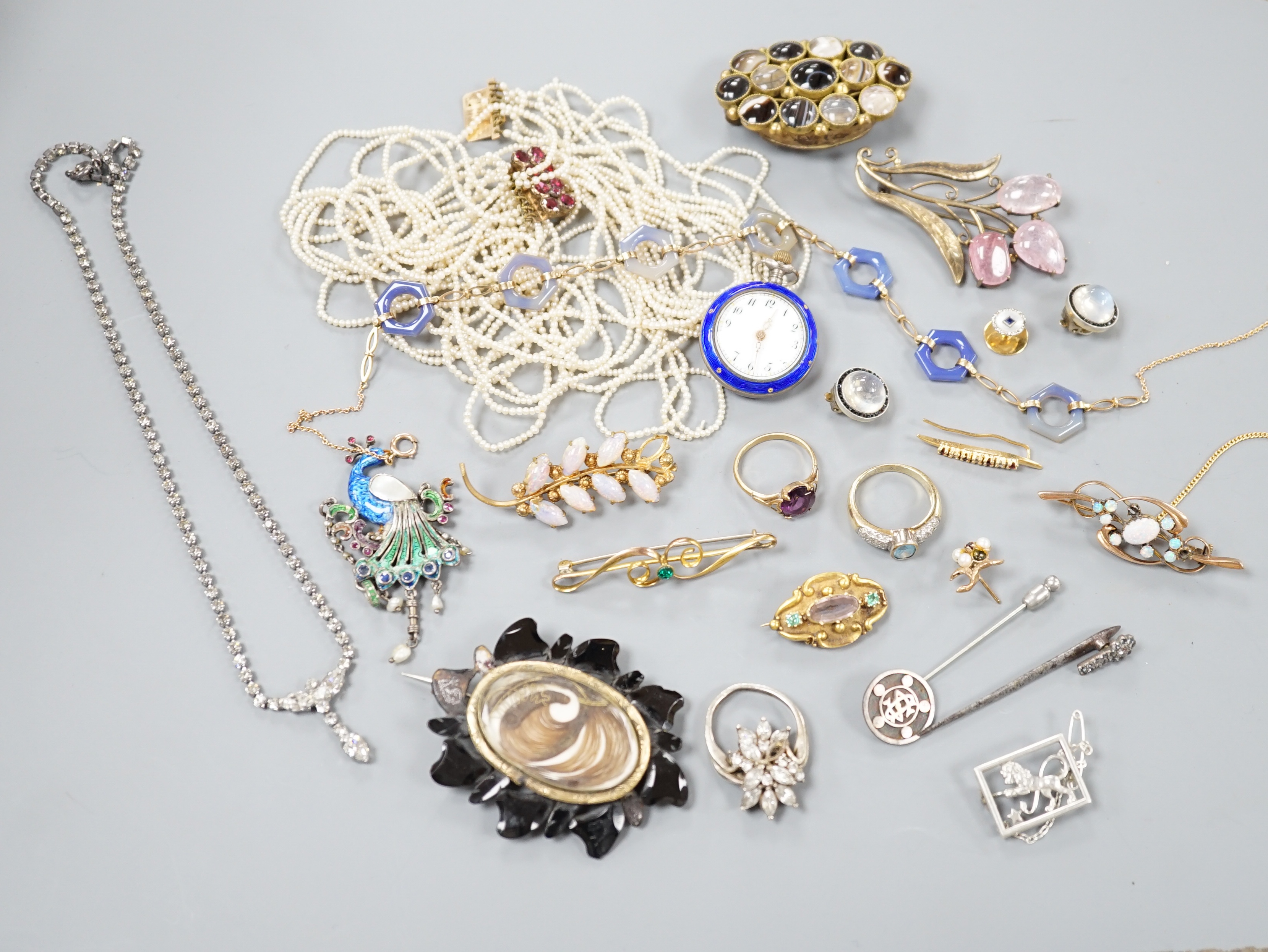 A quantity of mixed Victorian and later jewellery, including yellow metal and white opal scroll bar brooch, 18ct dress stud, 9ct and agate set necklace, seed pearl necklace(a.f.), enamelled peacock brooch, gem set Victor